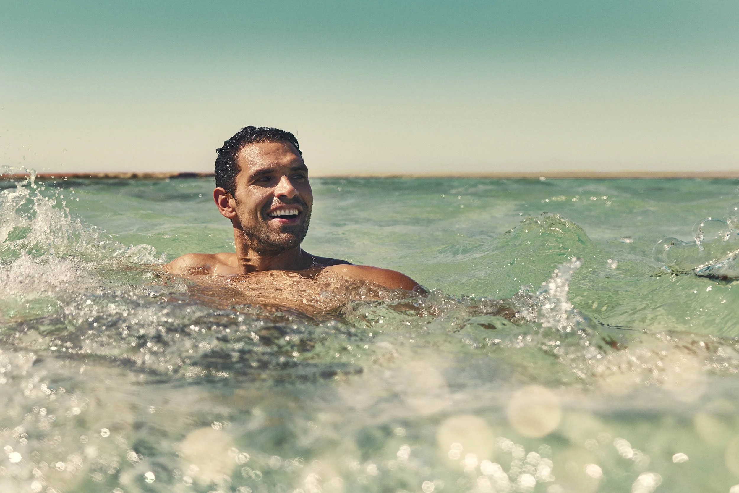 A holiday maker takes a swim in the sea off Sindalah island part of the Saudi Neom project in the lifestyle advertising image (Copy)