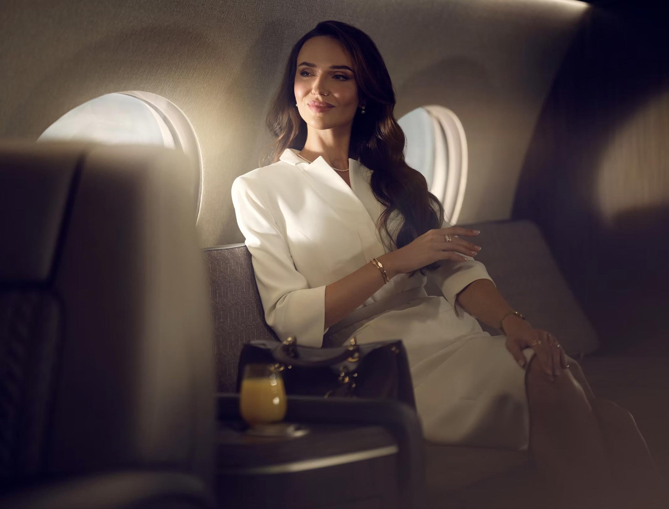 Aviation lifestyle image of a female business women onboard a private jet by luxury lifestyle photographer Jon Enoch (Copy)