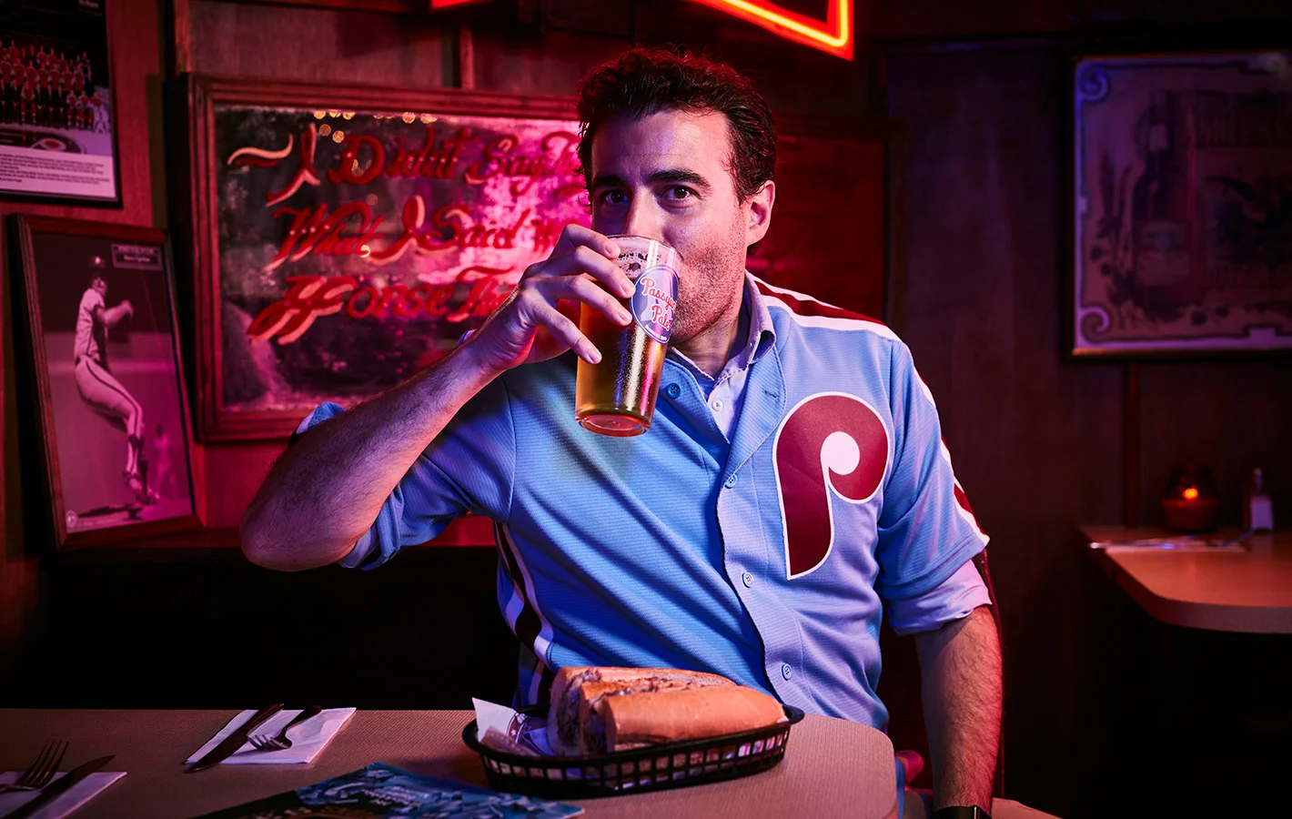A man drinks a beer in a US style bar  - photographed by London based lifestyle photographer Jon Enoch   (Copy)