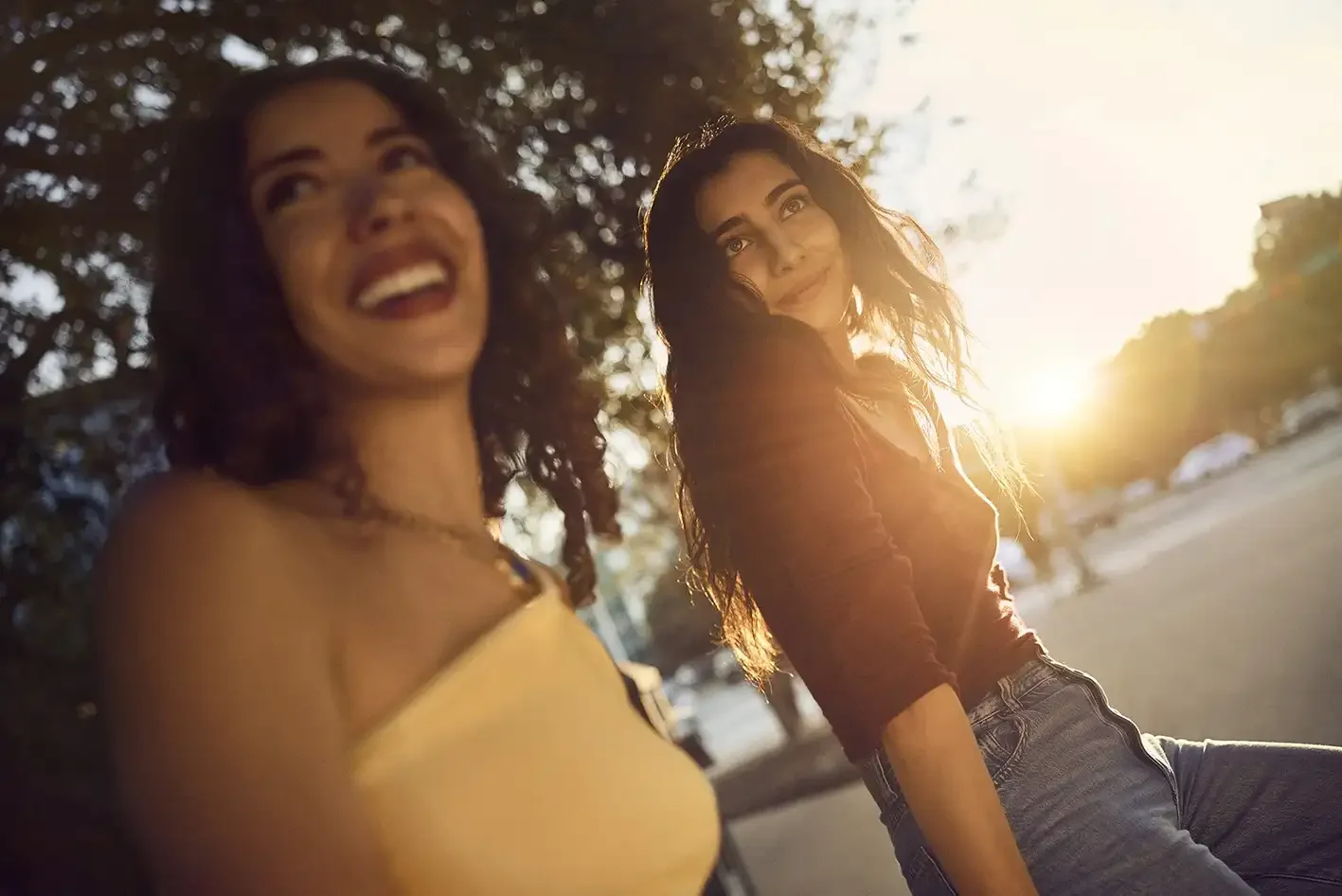 Two friends enjoy an evening together as the sun begins to set. The image captures authentic connection, spontaneity and the real moments that are central to contemporary lifestyle photography.
