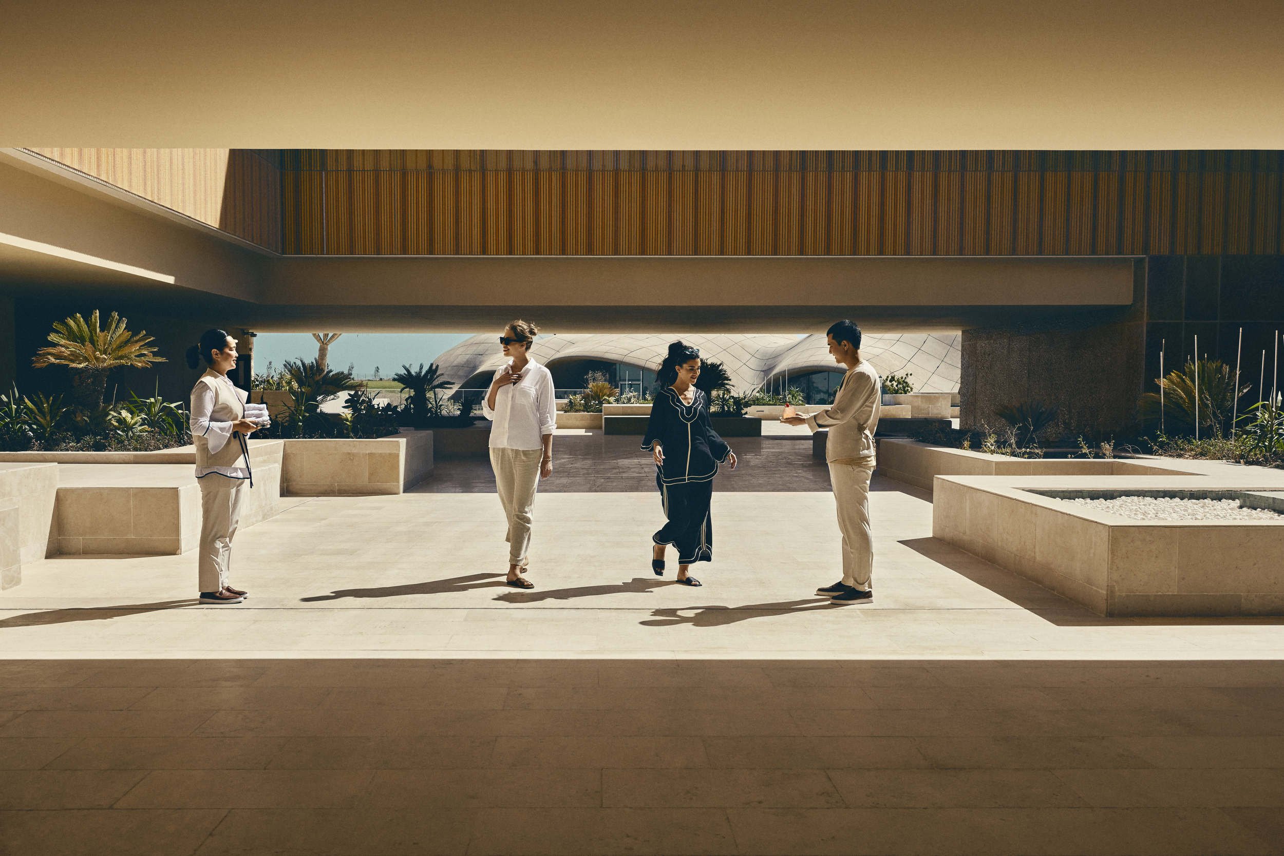 Guest arrive at their hotel in this lifestyle image shot for the Saudi Neom project featuring their Red Sea luxury holiday island Sindalah