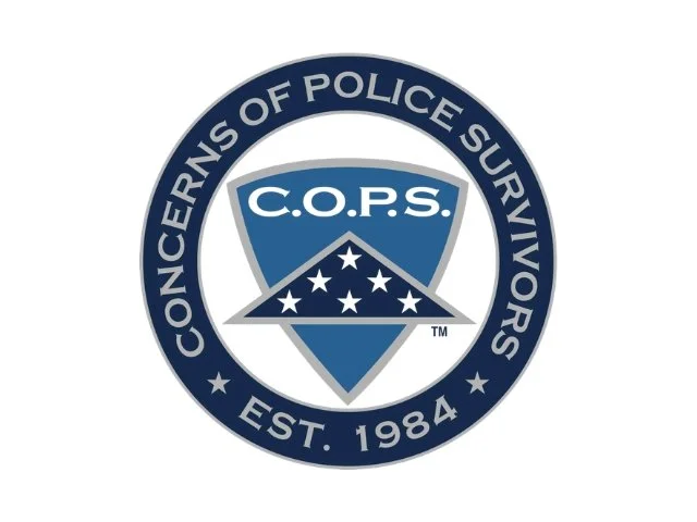 The logo of Concerns of Police Survivors (C.O.P.S.), featuring a shield with stars and the organization's name, surrounded by a circular border that states the organization's name and establishment year, 1984.