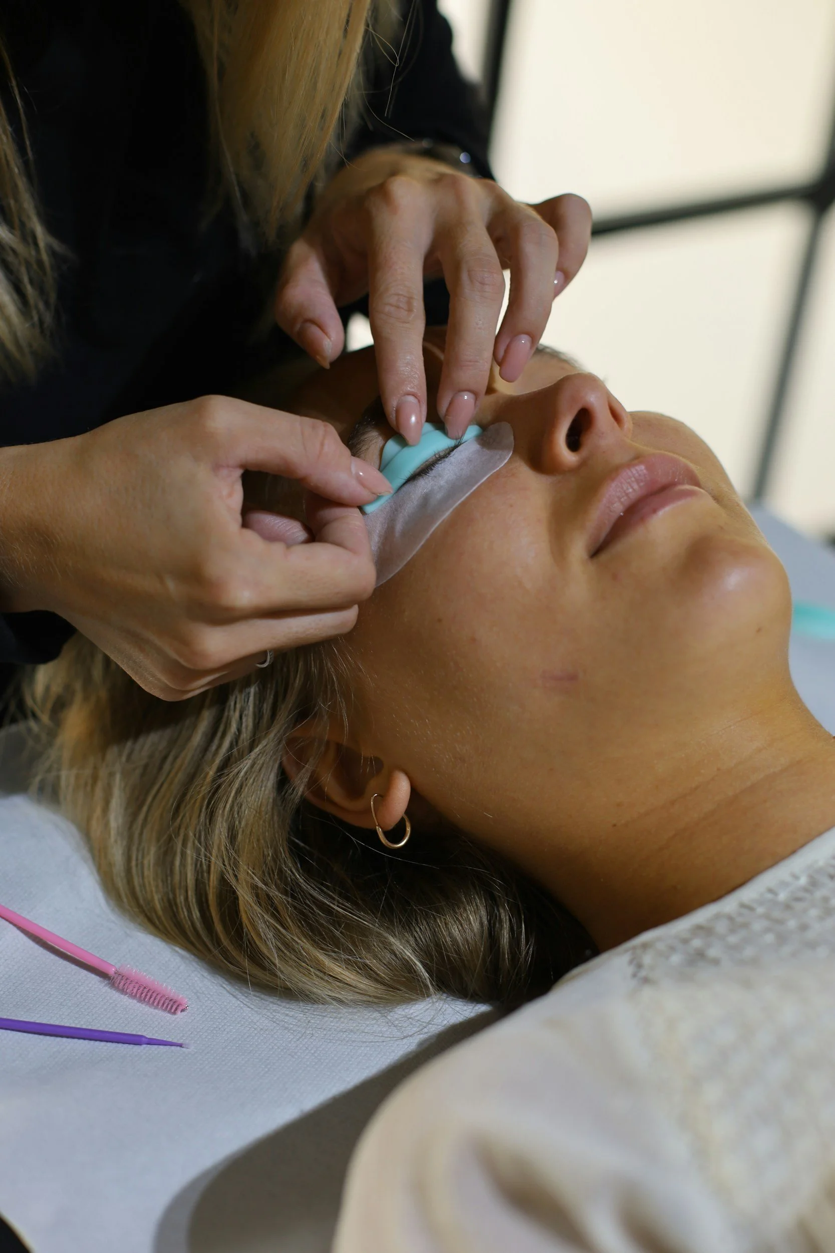 Korean and Classic lash lift application using a silicone shield to lift and position the natural lashes.