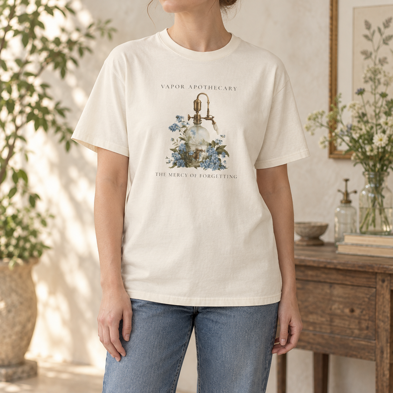 The Mercy of Forgetting T-shirt in Ivory, worn front-view mockup