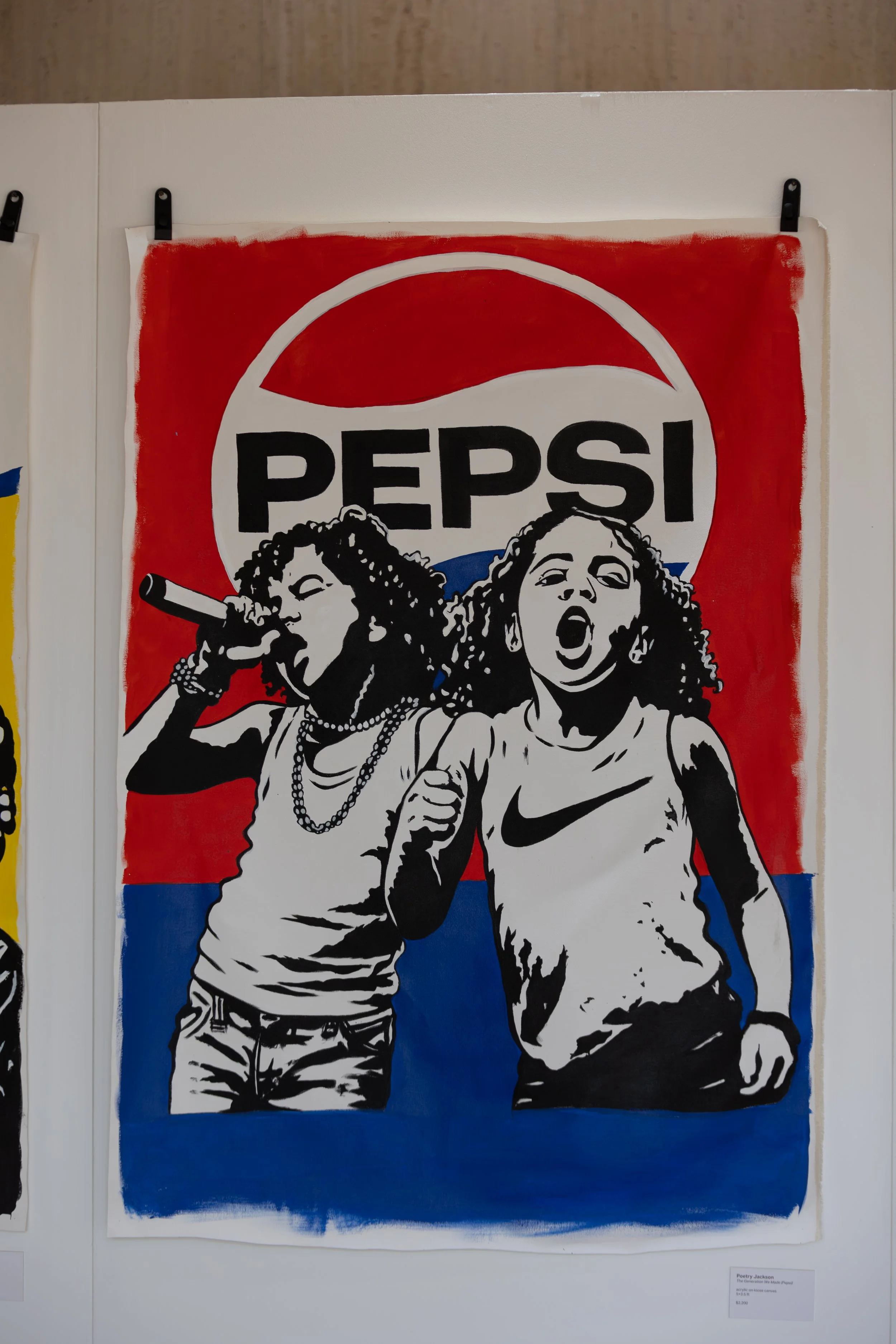 A street art poster with a red, white, and blue color scheme, featuring illustrations of two women. The woman on the left is singing into a tube, wearing earrings, necklaces, and a shirt with rolled-up sleeves. The woman on the right has her eyes closed and mouth open, wearing a Nike sports bra, with one arm bent and closed fist.