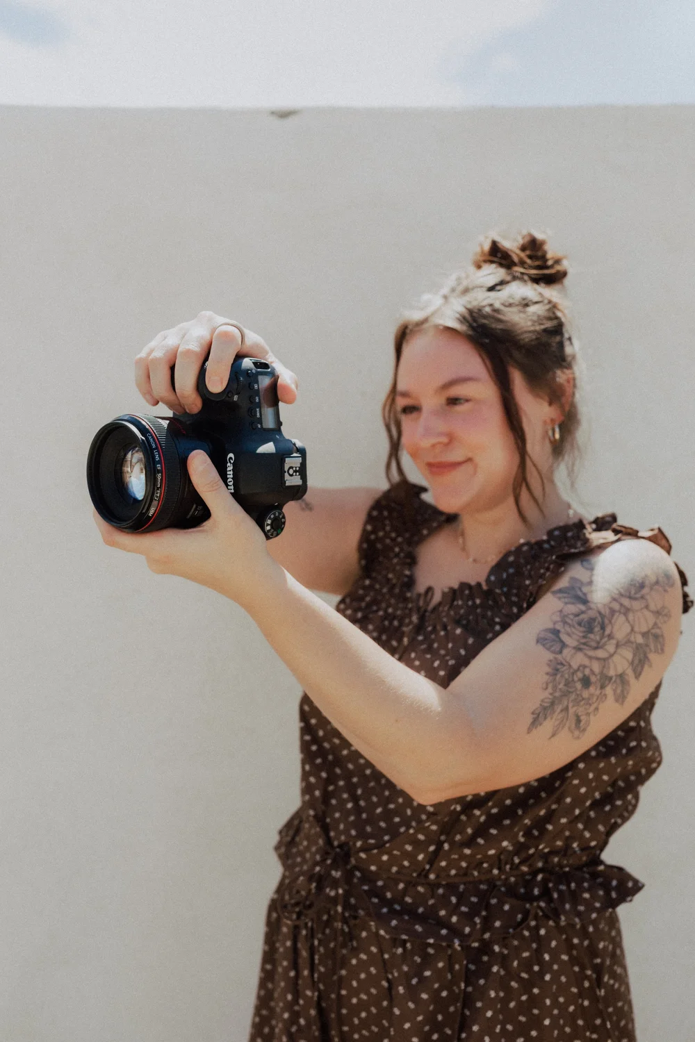 Calle Morain, social media strategist and documentary photographer, shooting with a Canon camera