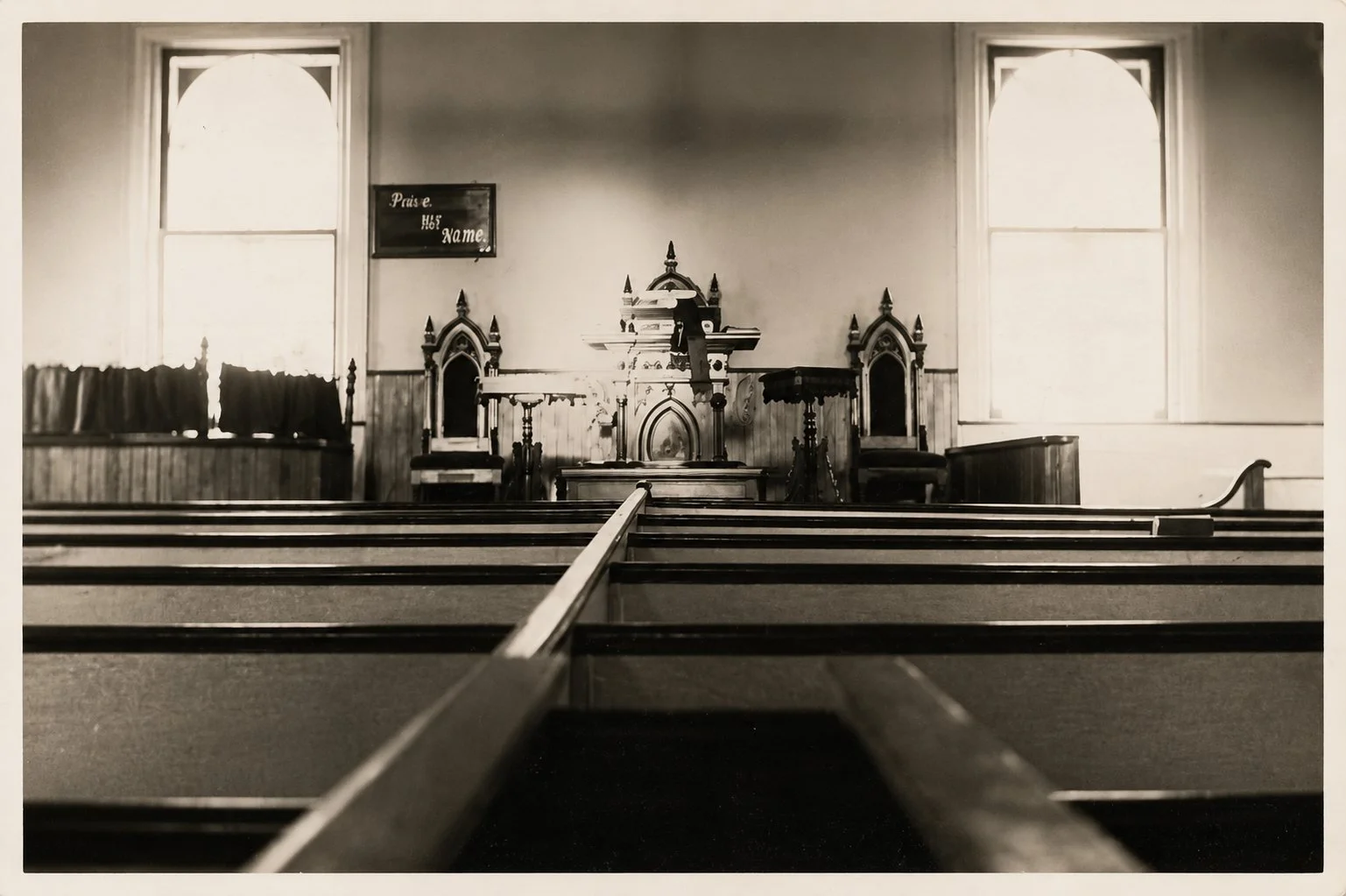 Interior of the Methodist Church looking toward the pulpit, before stained glass windows were installed in the rear of the building.


