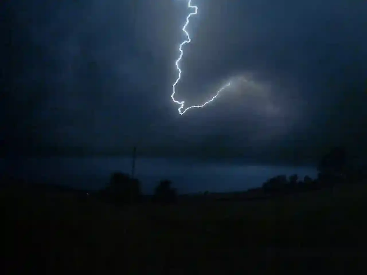 joyful lightning strike over ohio farm field