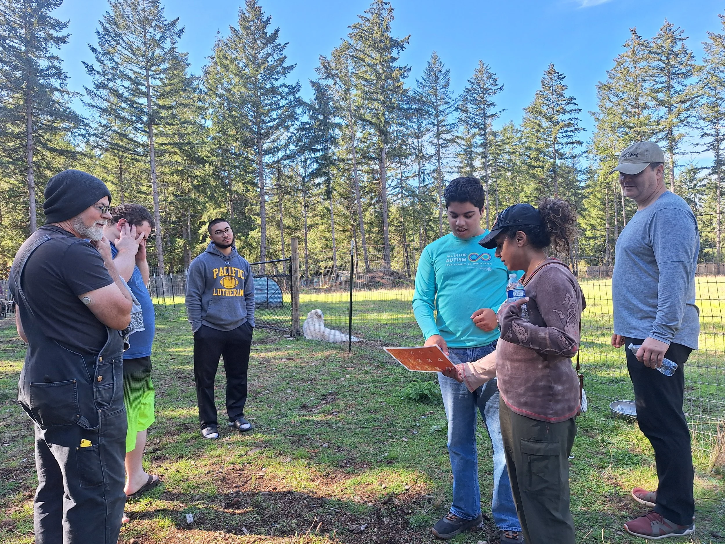 Group members standing together outdoors during a daily program activity.