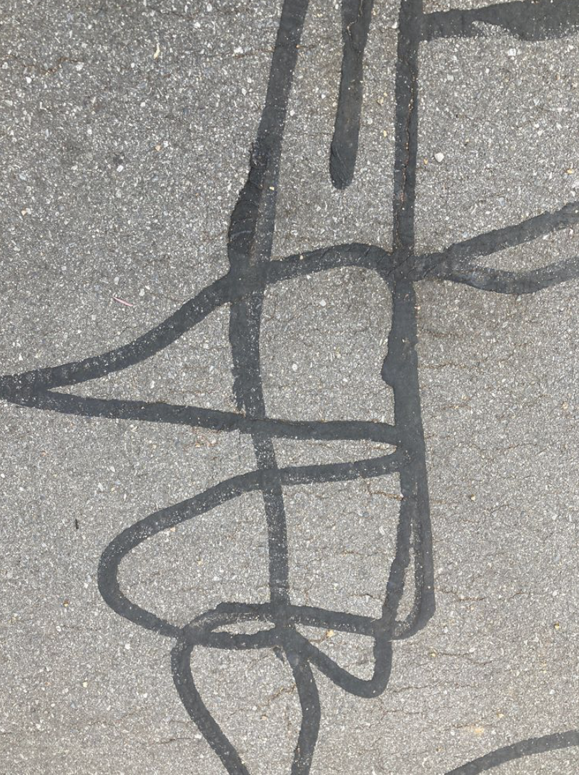 Graffiti - This graffiti caught my eye, it seemed more like artwork than road maintenance.
