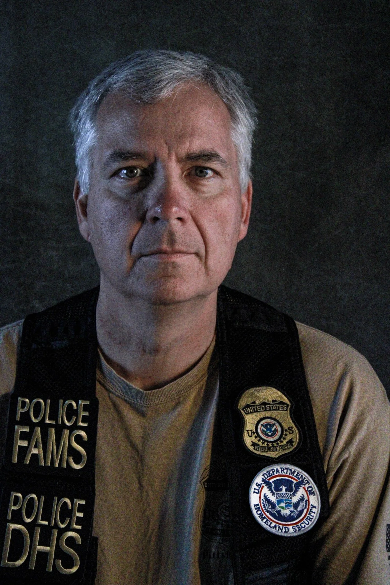 Josh Caldwell of Prepared Response Advisors consulting company.  Josh is wearing his Department of Homeland Security raid vest.  This picture is an image of the picture that was displayed in Congressman Pat Fallon's Washington DC office.