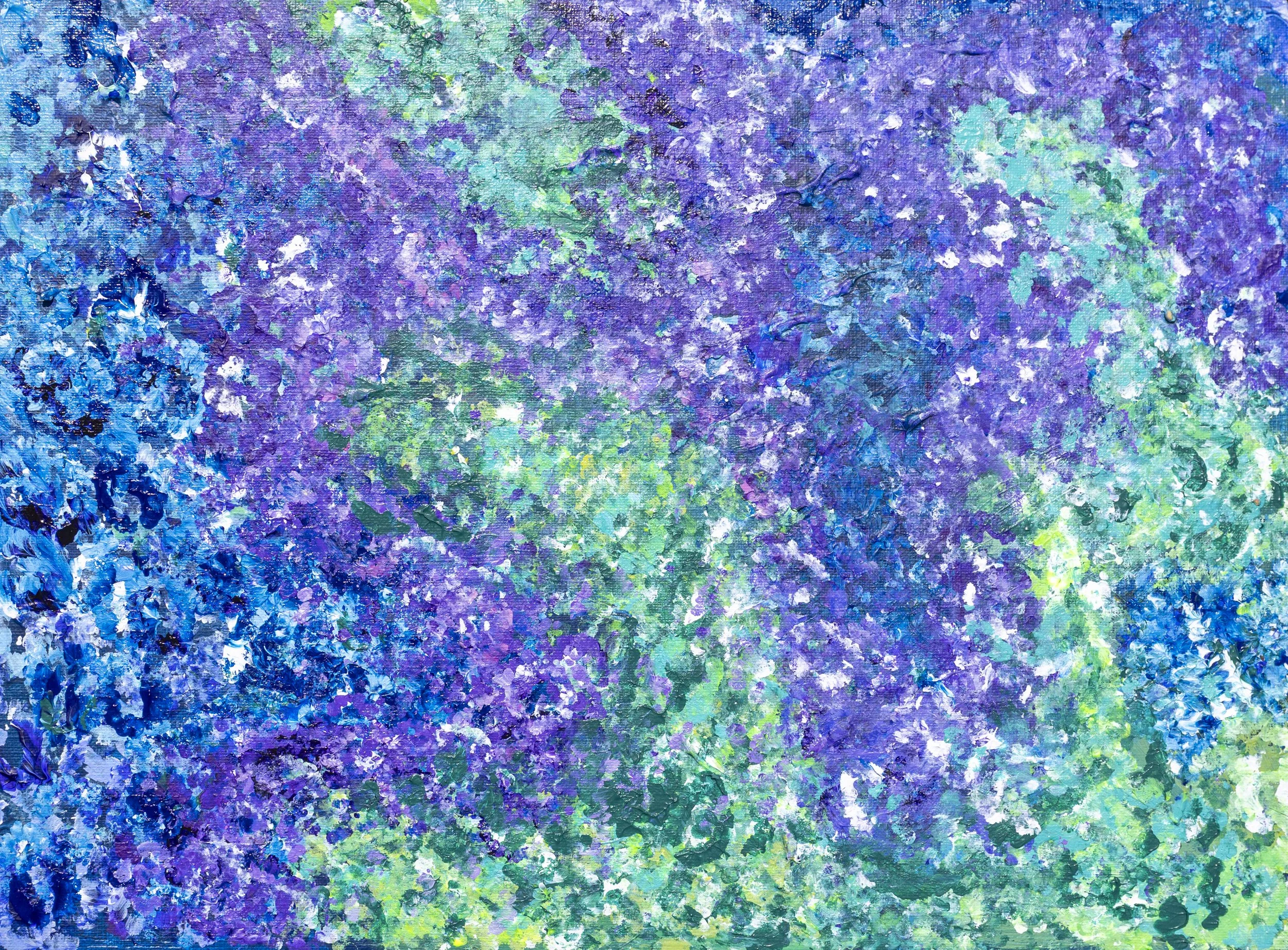 Close-up view of an abstract painting with vibrant blue, purple, green, and white colors, textured with thick brushstrokes.