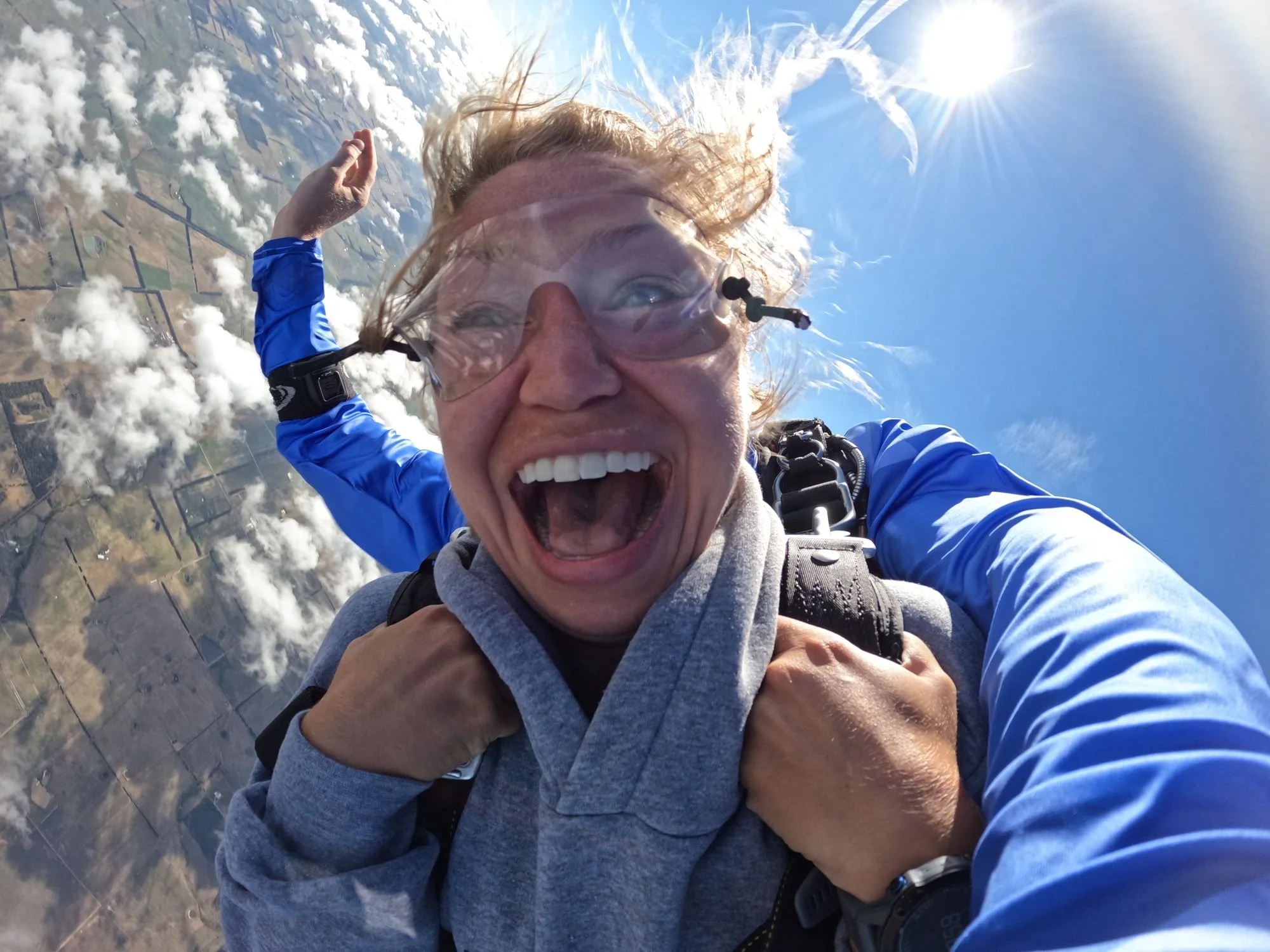 Excited tandem skydiver in freefall on a Great Ocean Road skydive