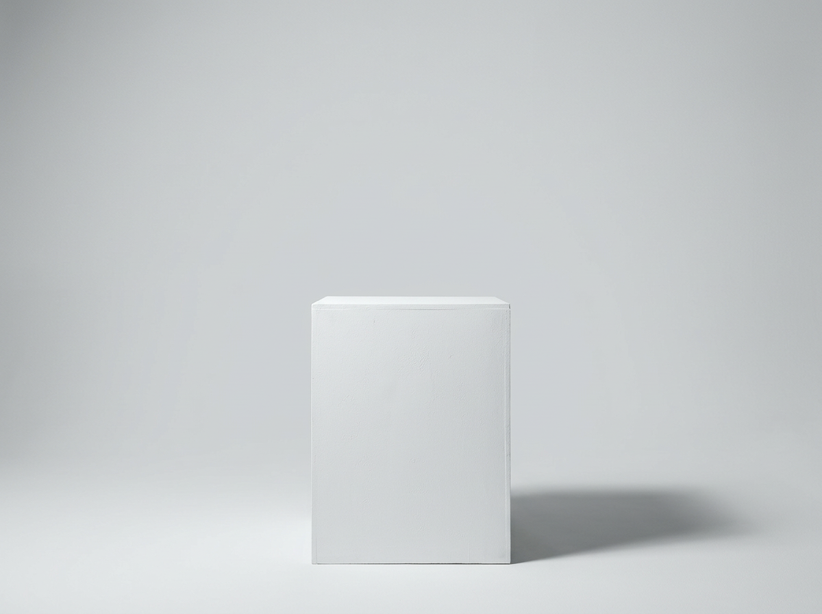 A plain white pedestal against a gray background.