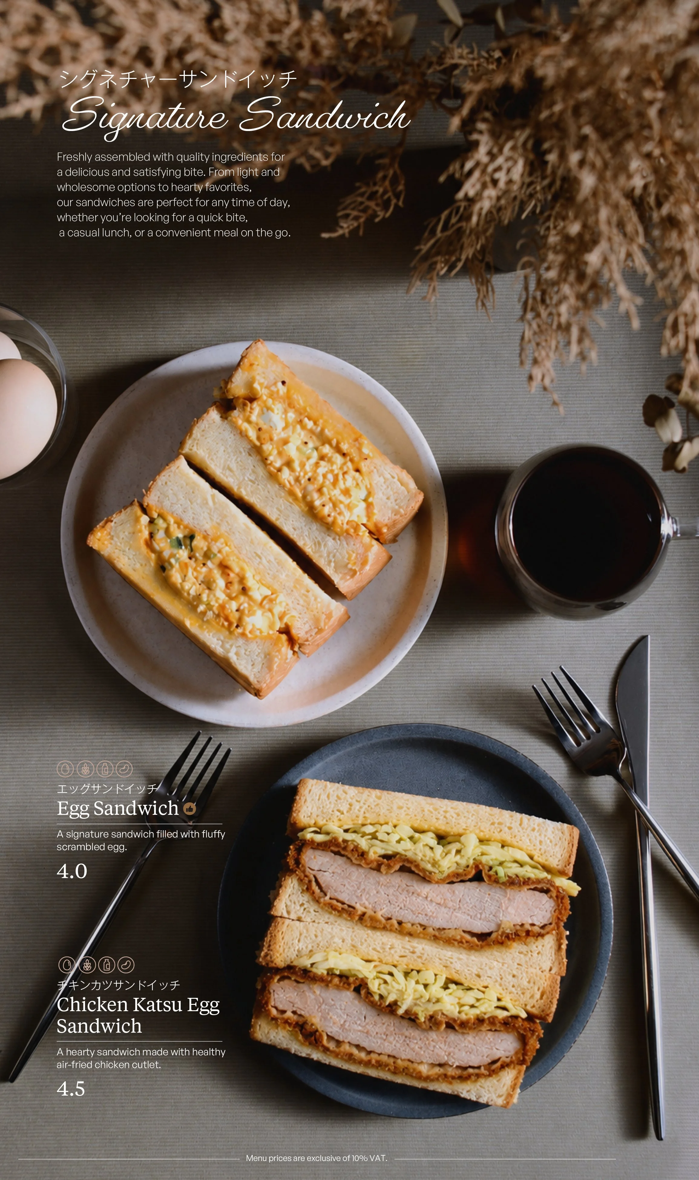 Overhead view of a table setting with two sandwiches, a glass of dark beverage, and some eggs in a bowl, with text overlay describing egg sandwich and chicken katsu egg sandwich.