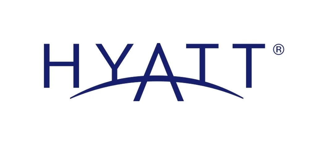 Hyatt hotel logo with the word 'HYATT' in blue capital letters and an arc beneath the text.