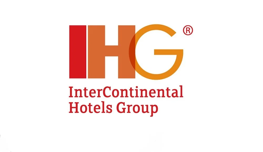 Logo of InterContinental Hotels Group with large red, orange, and gold letters IHG and red text below that says 'InterContinental Hotels Group'.