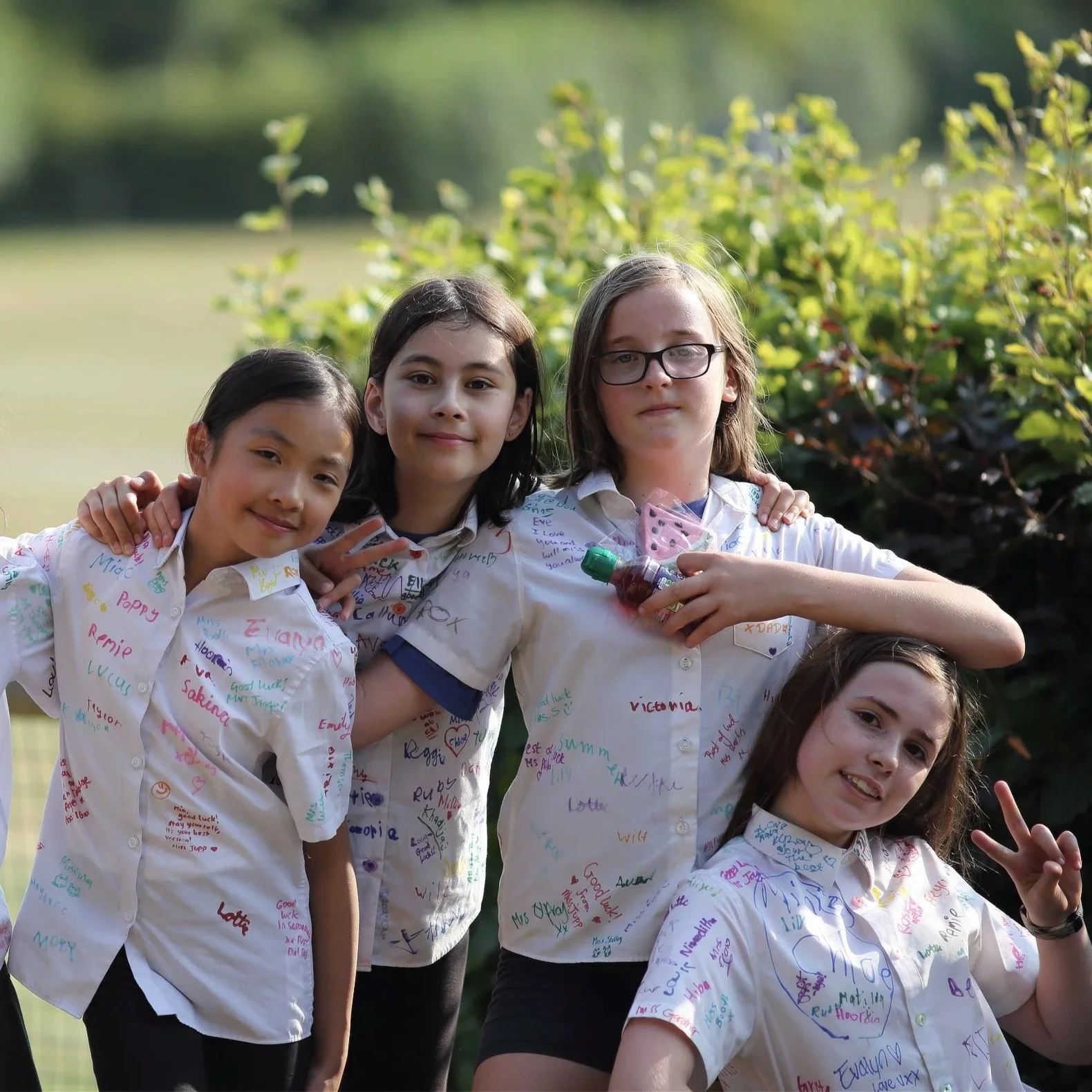 year 6 girls enjoying the last school day in a park with great friendship