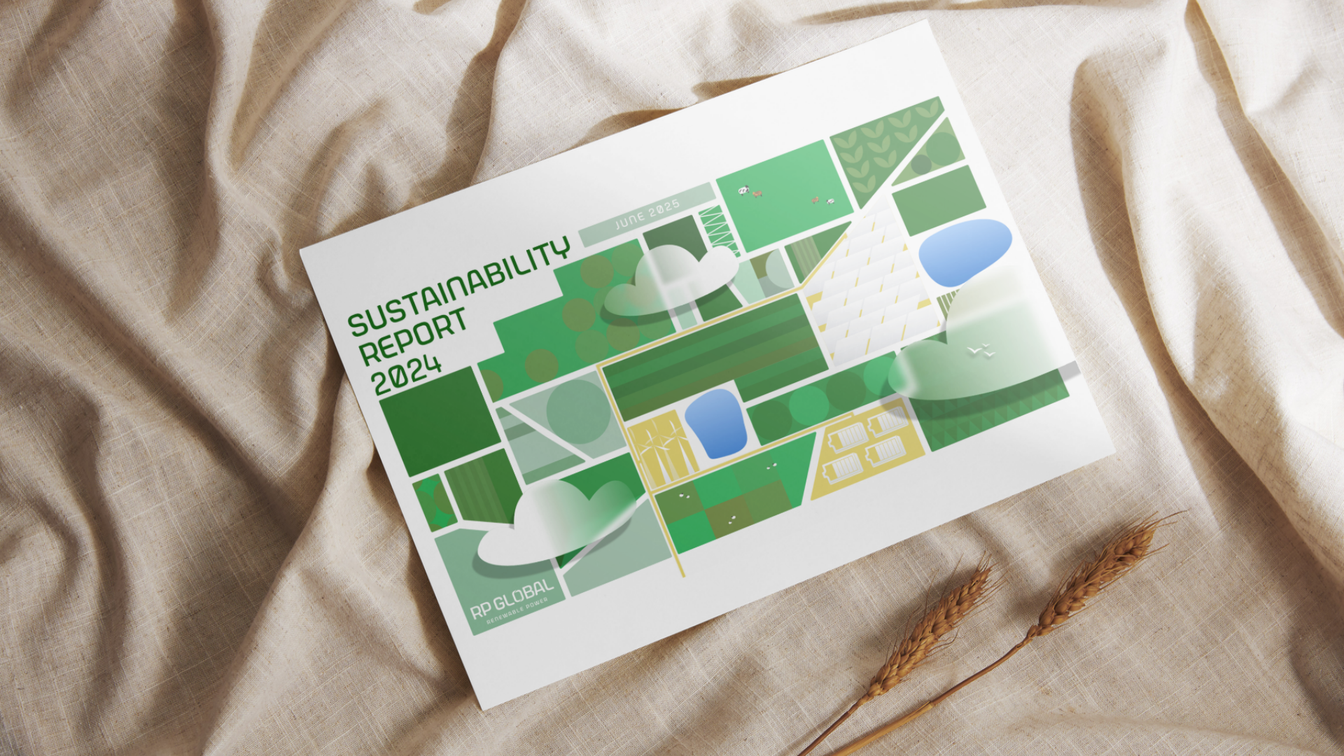 A printed sustainability report for 2024 with a green-themed design, laying on a beige fabric surface next to wheat stalks.