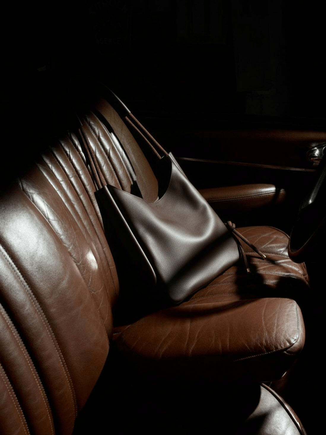 Luxury car interior representing the discreet, high-end travel and professionalism of Swiss Premier executive candidates.
