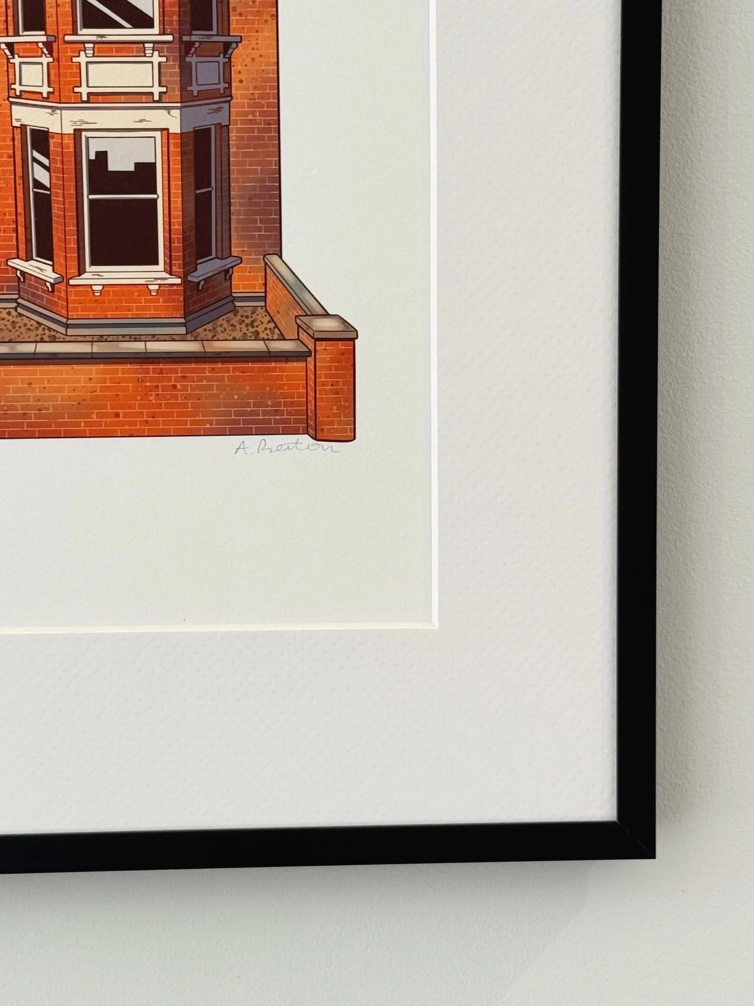A framed illustration of a red brick building with bay windows and white decorative trim, signed by A. Berton.
