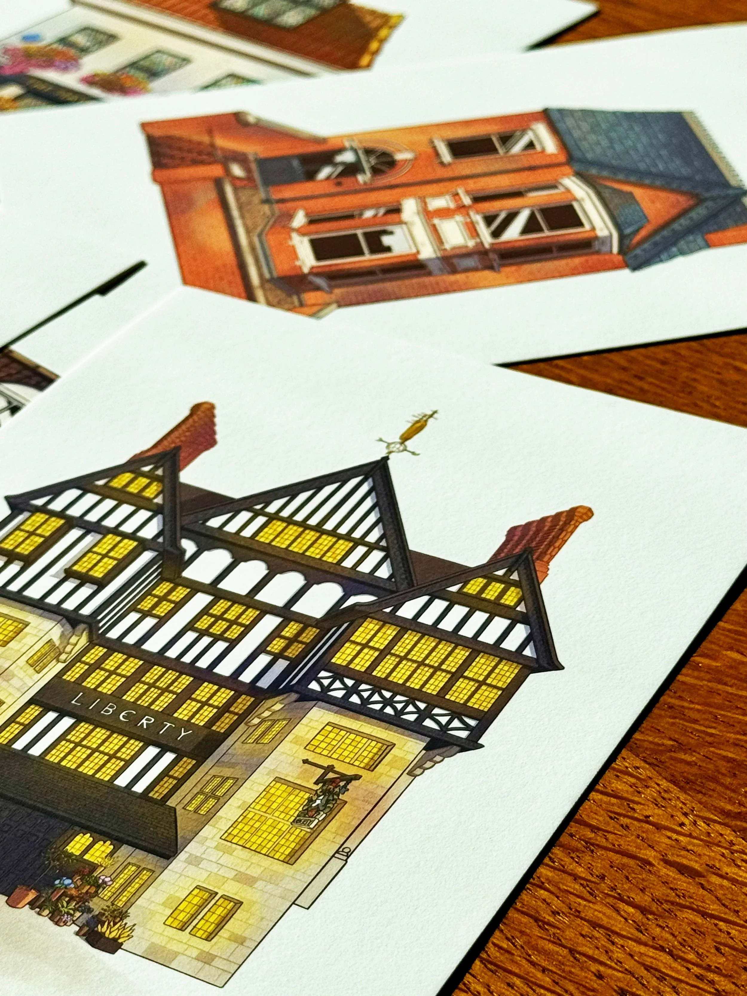 Illustration of a historic brick and timber building labeled "Liberty" with yellow windows and a statue at the entrance, placed on a white background.