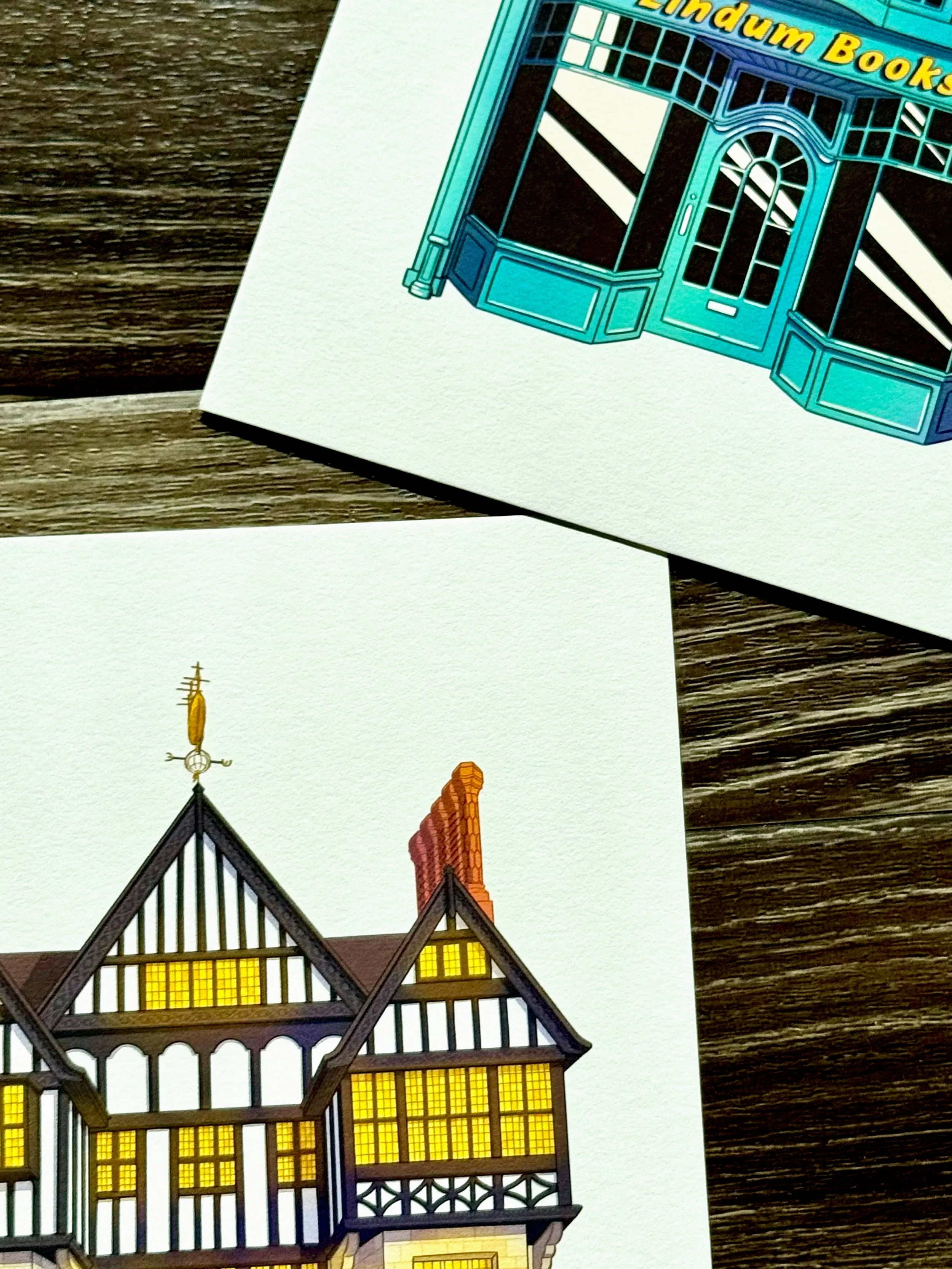 Close-up of illustrated buildings with yellow-lit windows and a ornate roof.