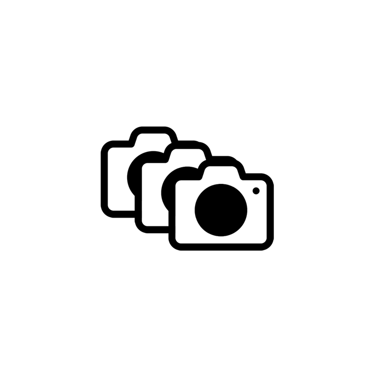 Icon of four overlapping camera illustrations inside a white circle with a black background.
