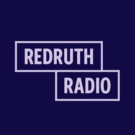 Redruth Radio logo with purple background and white text.