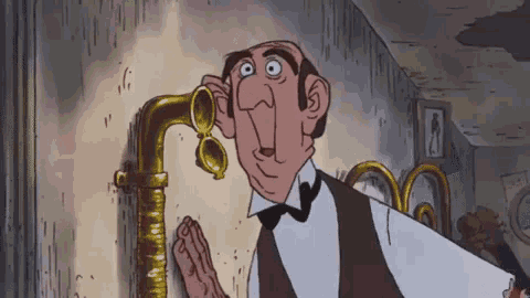 Un personaggio dei cartoni animati con occhiali da compras, vestito con una camicia bianca e una giacca marrone, si appoggia a un rubinetto d'oro in una stanza con pareti grigie e un orologio.