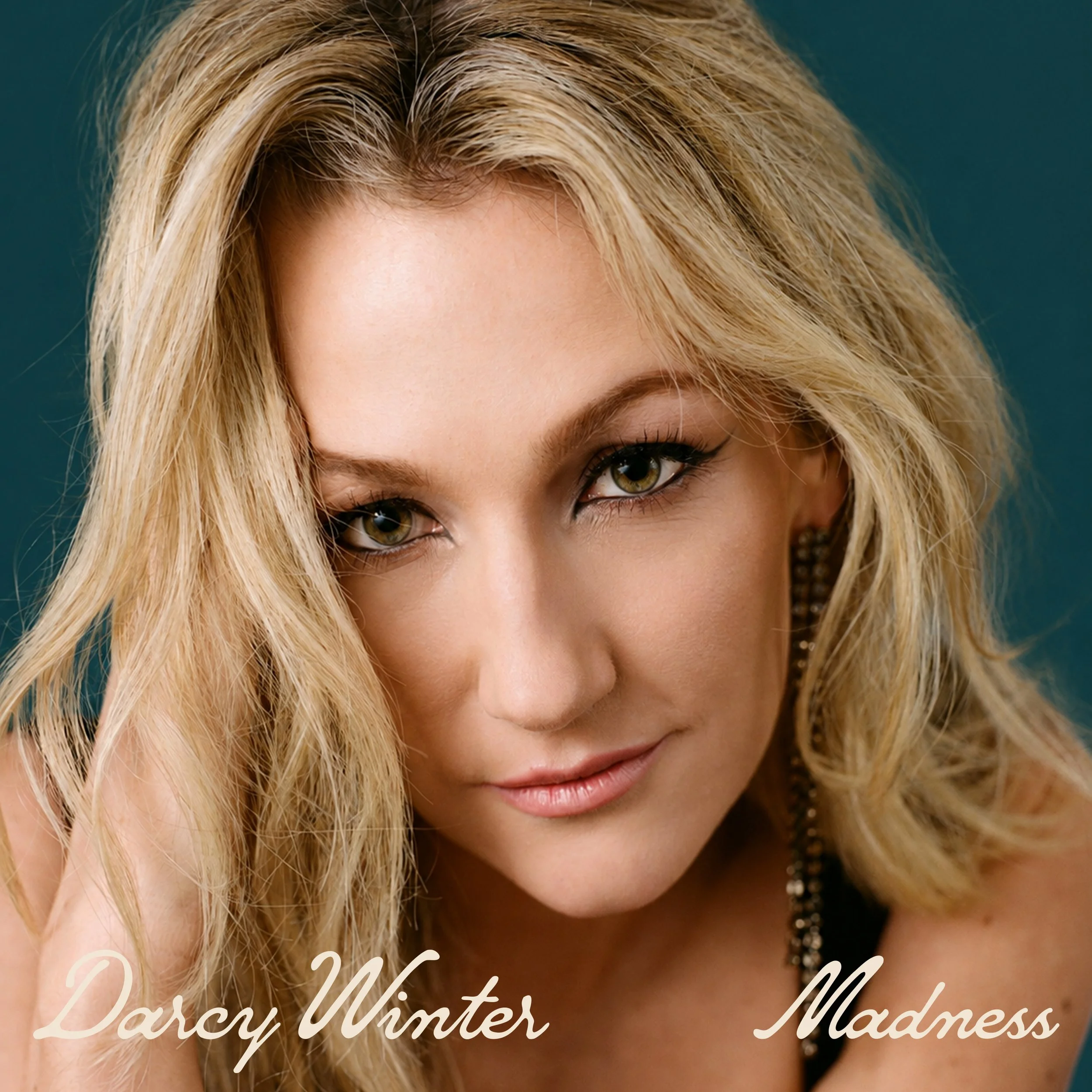 Close-up photograph of a Darcy Winter for her unreleased song Madness.