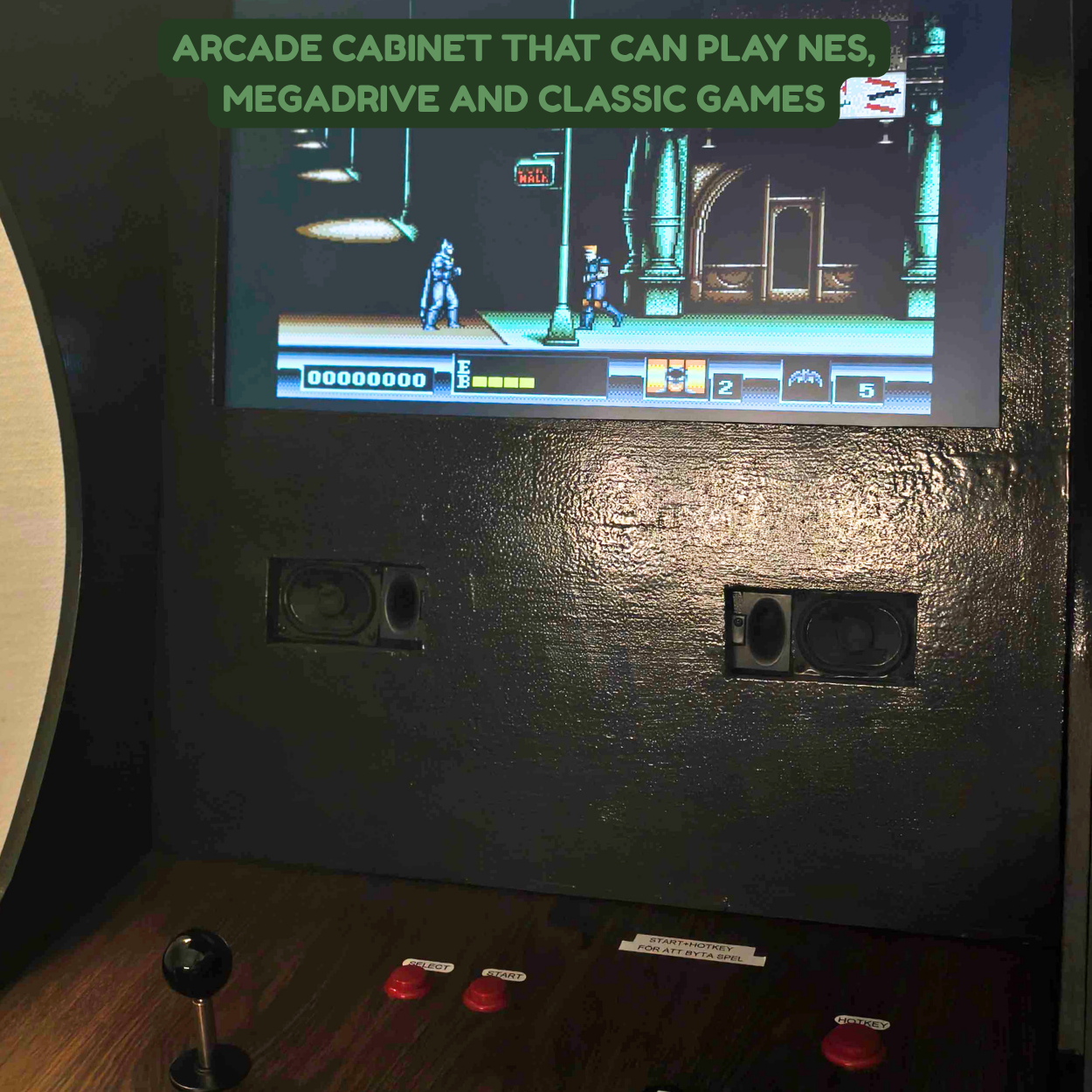 An arcade cabinet with a screen displaying a vintage 8-bit video game set in a cityscape, with characters and game stats visible. The arcade cabinet has speakers and control buttons, including a joystick and red buttons.