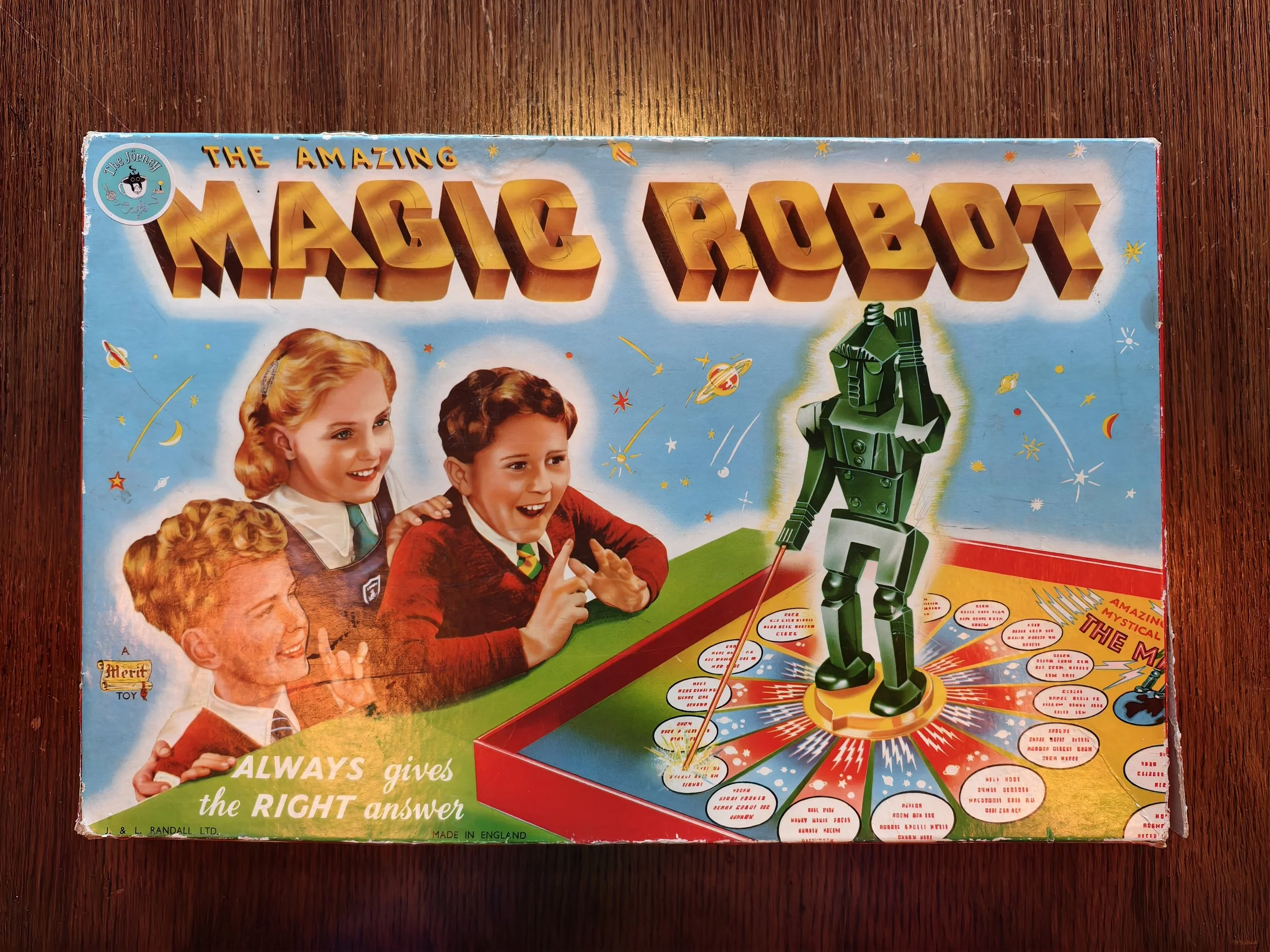Vintage board game box titled "The Amazing Magic Box" features children and a toy robot on a colorful space-themed background.
