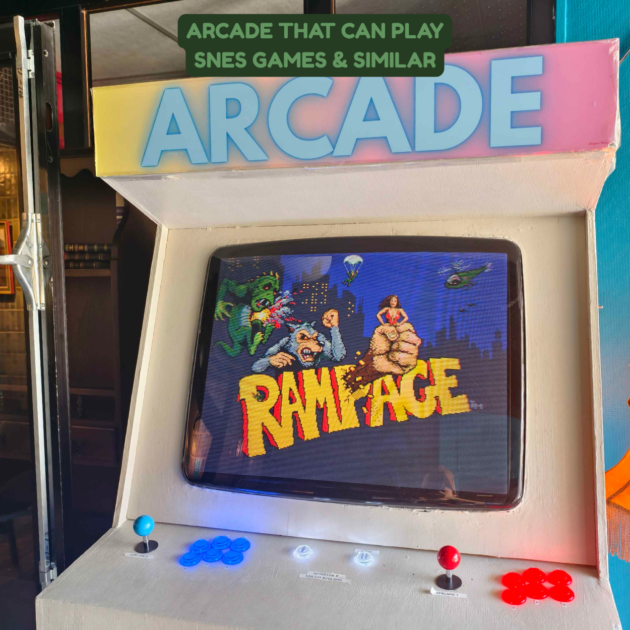 Classic arcade game cabinet featuring a pixelated game titled 'Rampage', with colorful characters and a cityscape background.