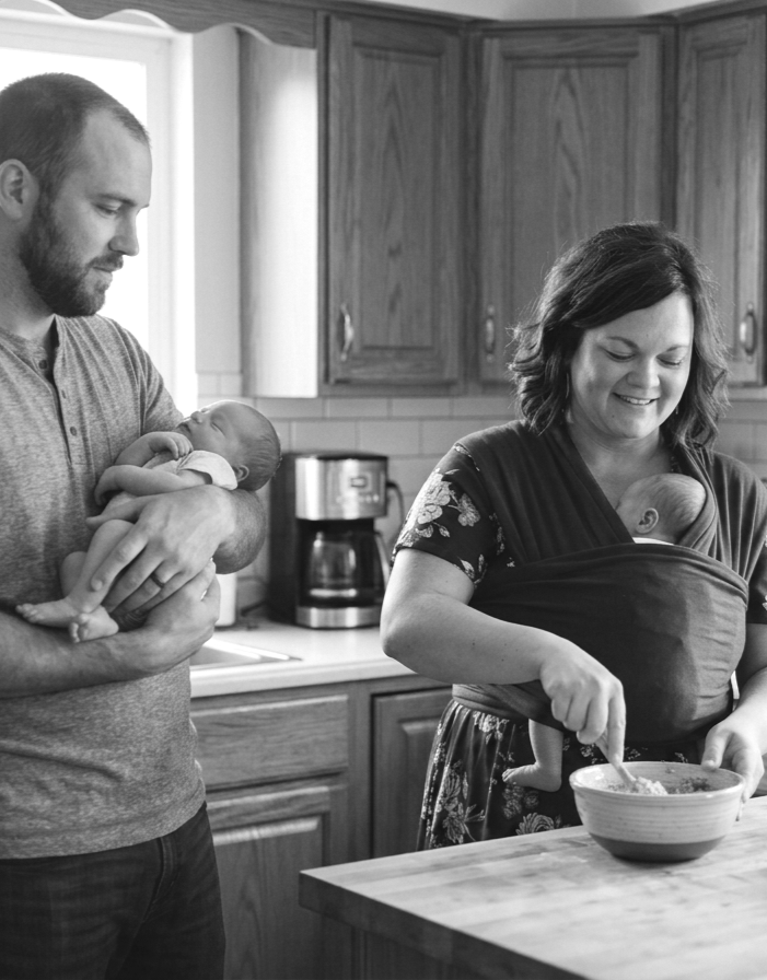 Doula providing postpartum support in a home in Iowa.