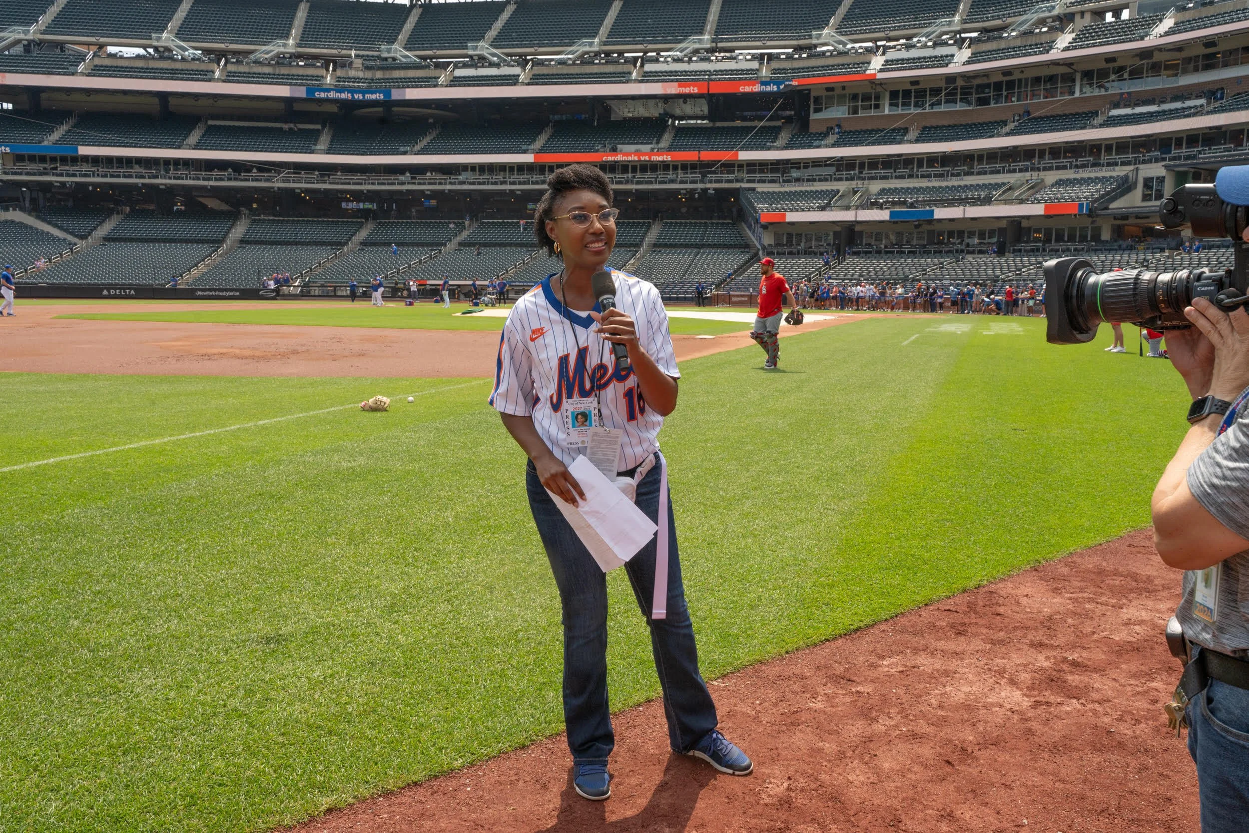 Stacy-Ann Gooden at the New York Mets baseball game, speaking to the crowd.
