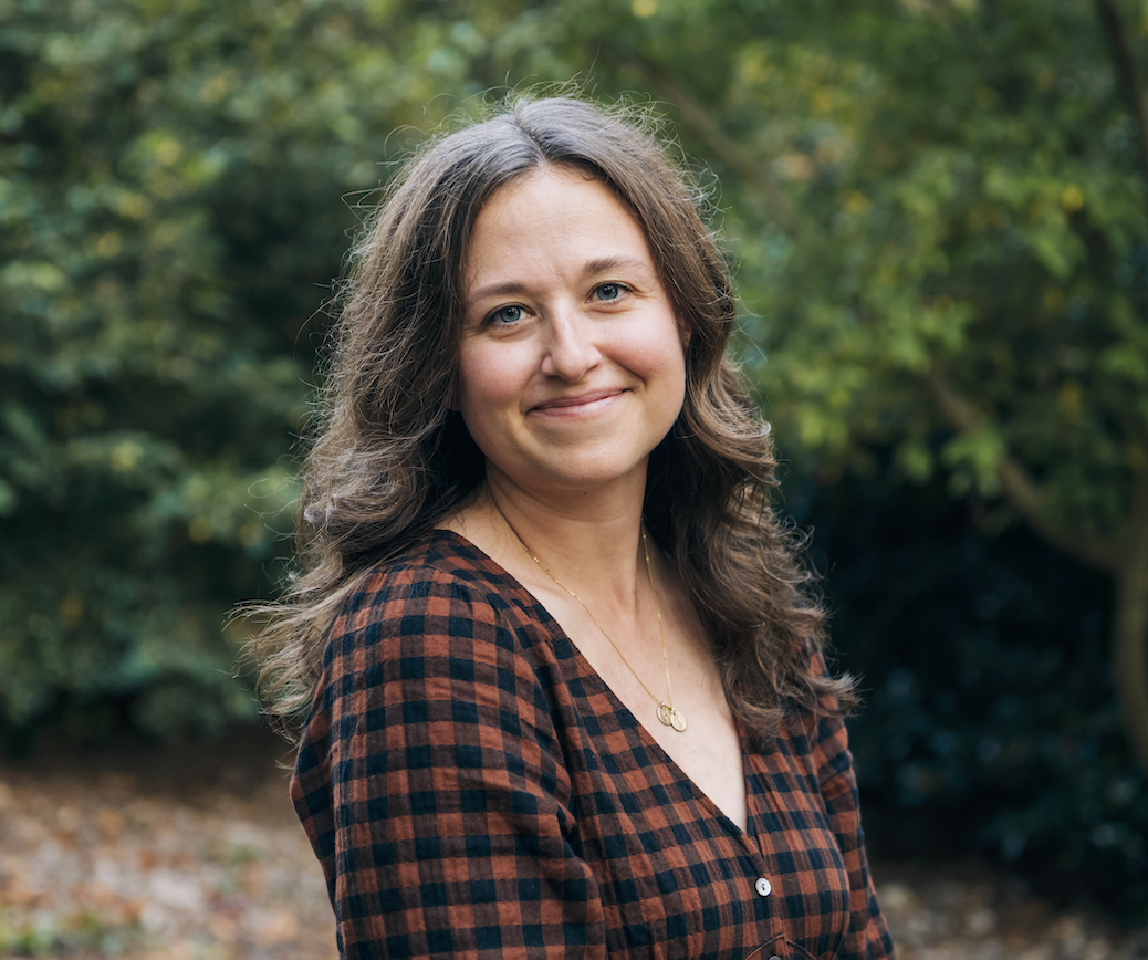 Photo of Leeaan Haines smiling against a background of trees