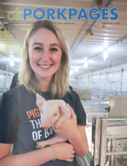 Cover of Oklahoma Pork Pages featuring a young woman with blonde hair smiling and holding a piglet inside a farm or piggery facility.