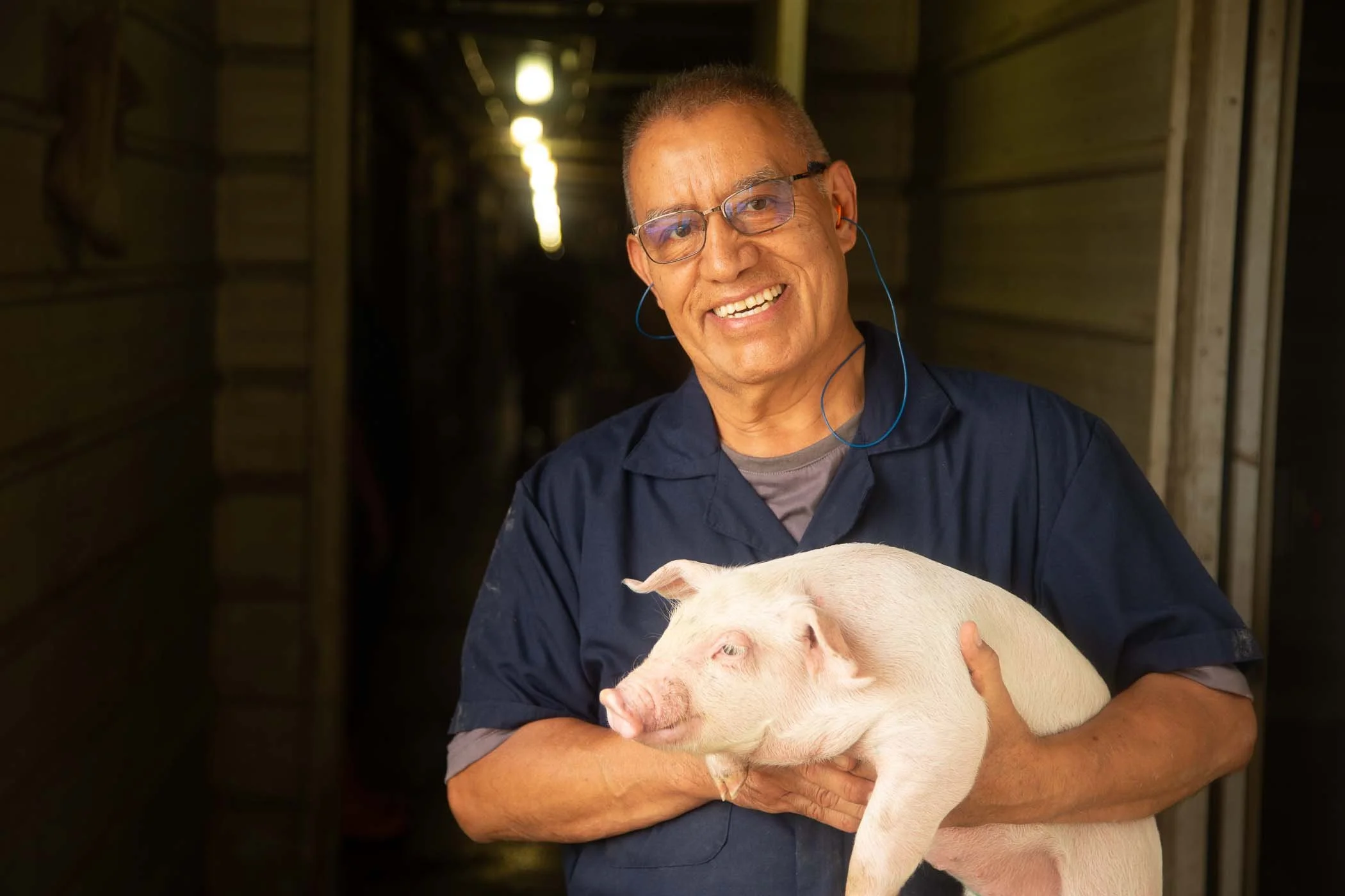PQA Man Holding Pig.png