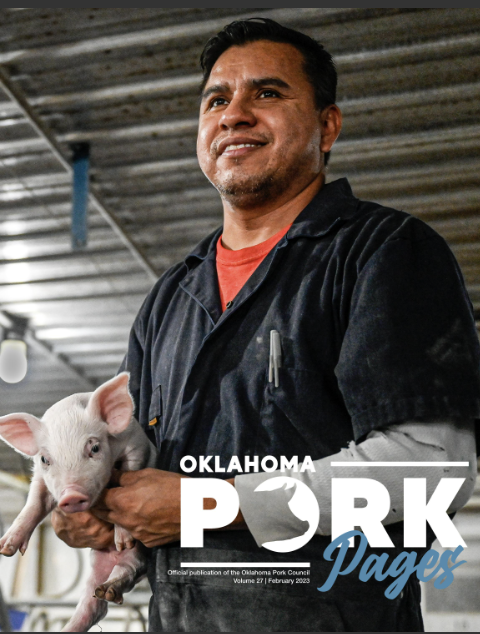 Cover of Oklahoma Pork Pages featuring a man holding a piglet at an Oklahoma Pork publication event, with the text 'Oklahoma Pork Pages' on the cover.