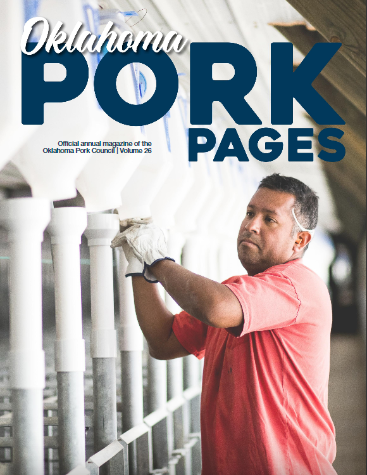 Cover of Oklahoma Pork Pages magazine featuring a man in a red shirt inspecting pig enclosures.