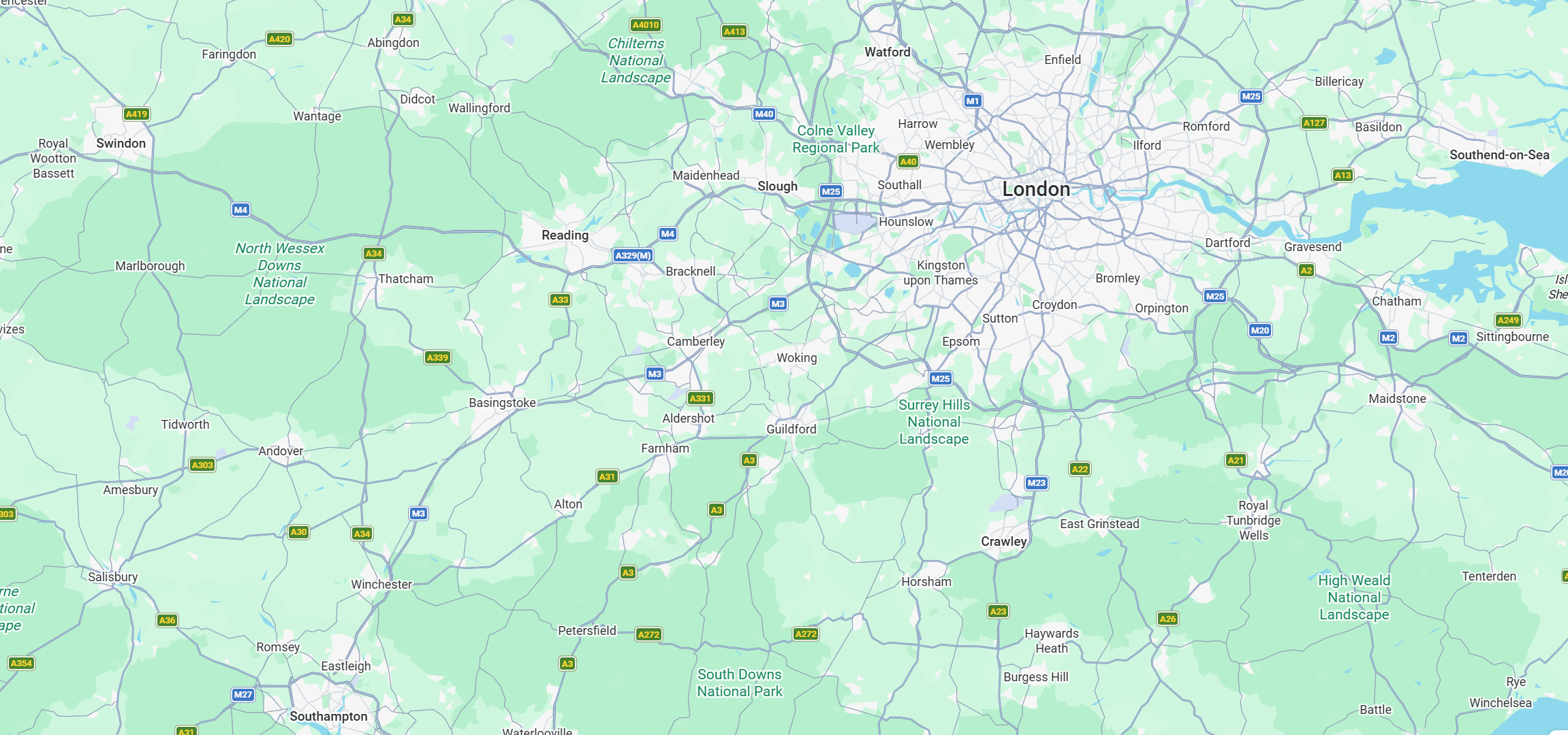 Map showing areas around London, UK, including national parks like Chilterns, North Wessex Downs, Surrey Hills, and South Downs, with roads and towns marked.