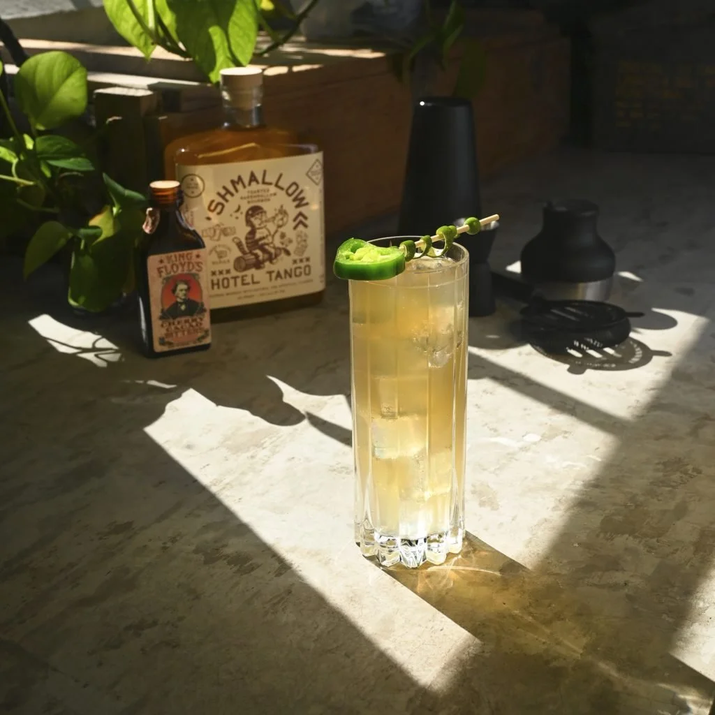 Sizzled Spritz made with Hotel Tango 'Shmallow Whiskey, garnished with jalapeño and lime.