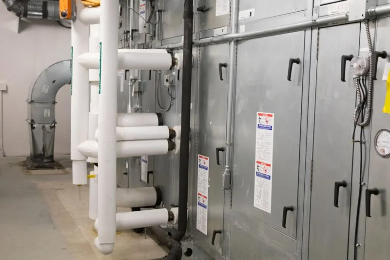 Air-handling equipment and insulated piping at the ACTC Main Building renovation in Ashland, Kentucky.