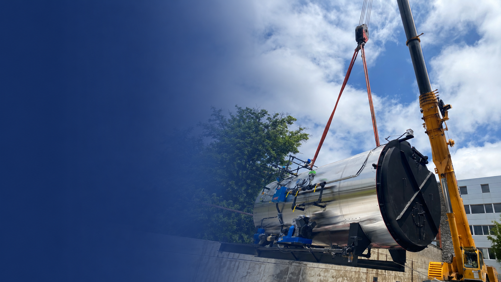 Commercial boiler installation using a crane for CIMCO Building Services.