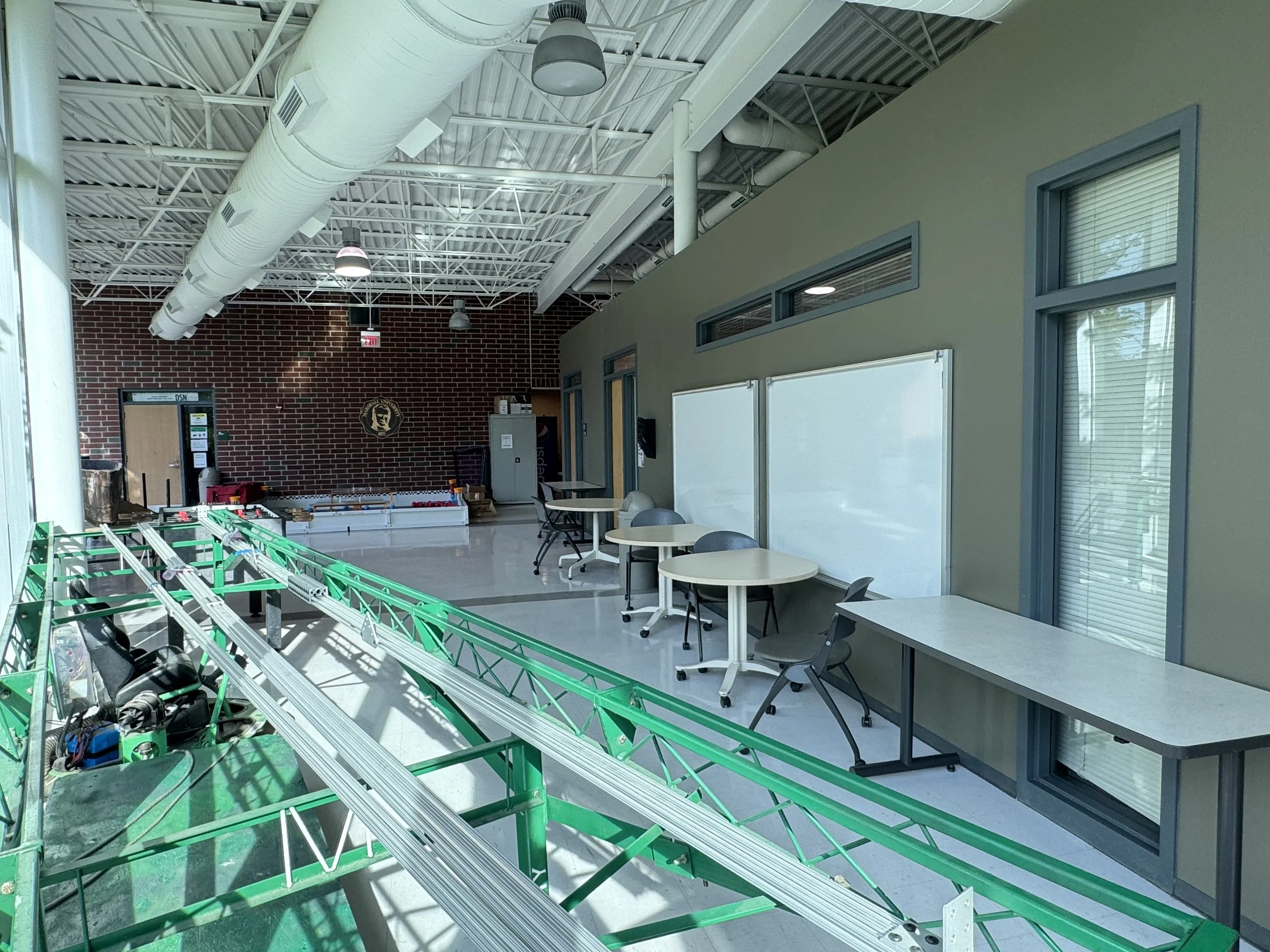 Engineering laboratory with exposed mechanical systems and structural testing equipment at Marshall University.