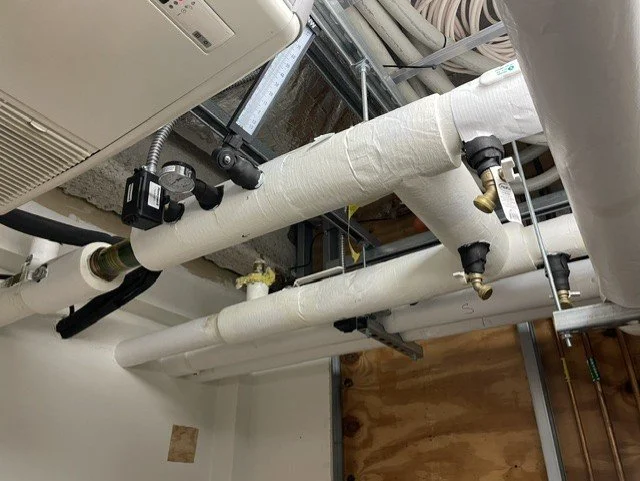 Insulated mechanical piping and valves installed at the Robert & Lena Shell Medical Pavilion.