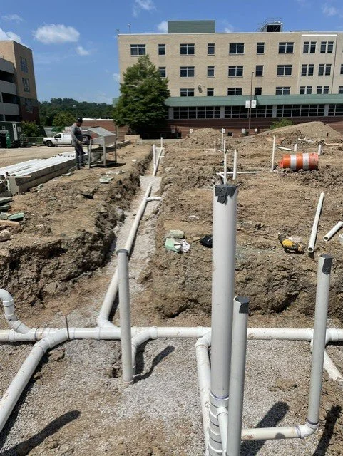 Underground plumbing rough-in and risers at the Robert & Lena Shell Medical Pavilion in Huntington, West Virginia.