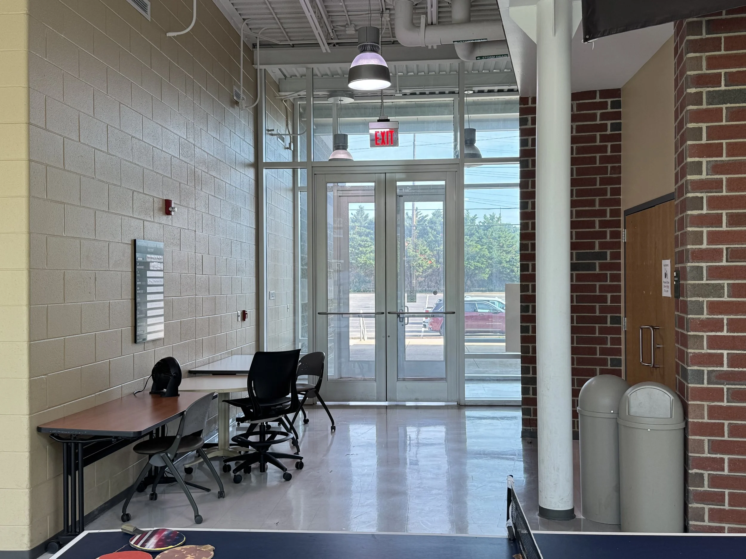 Engineering Laboratory entrance with exposed mechanical systems and glass entry doors at Marshall University.