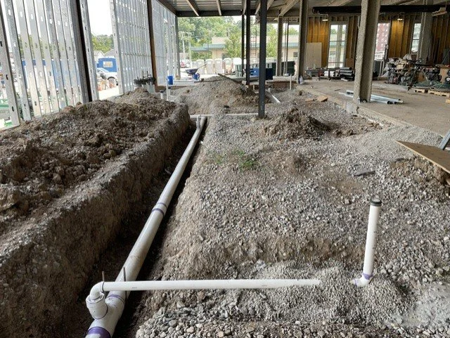 Underground plumbing rough-in at the Robert & Lena Shell Medical Pavilion during construction.